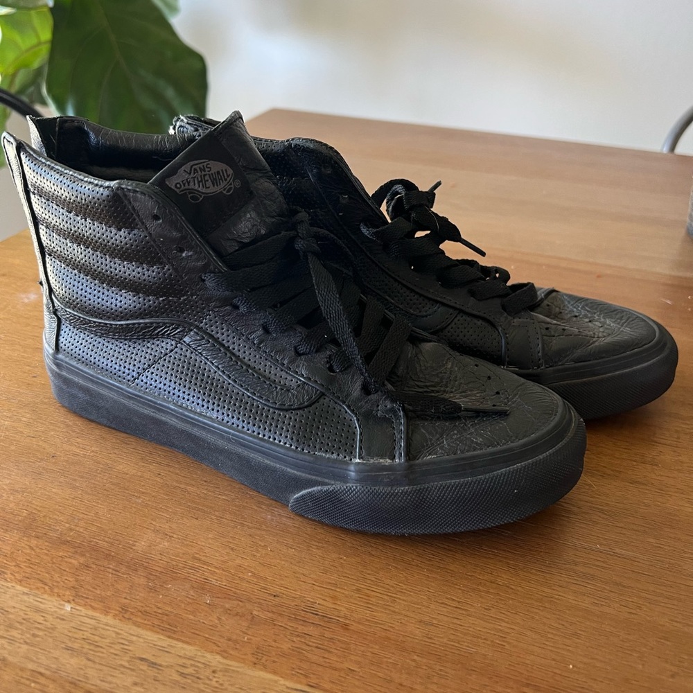 Black leather high top vans